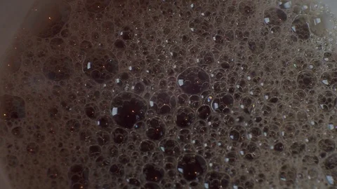 Bubble foam in a dark liquid Stock Footage 116903400