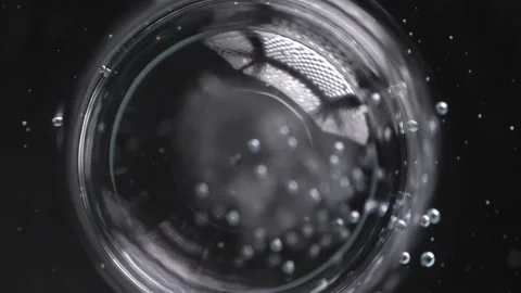 Bubble joint together to be a bigger one isolated on black background Stock Footage 238046956