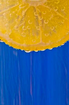 Bubble lemon on a blue blurred background Stock Photos