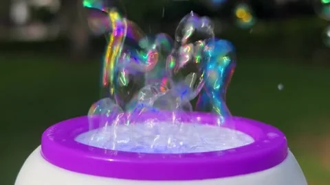 Bubble machine with multicolored transparent colorful soap bubbles 動画素材 331172997