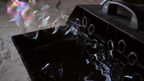 Bubble machine. Soap bubble generator in operation. Stock Footage 289479814