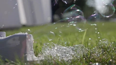 Bubble making device on ground at wedding in slo mo Stock Footage 252395146