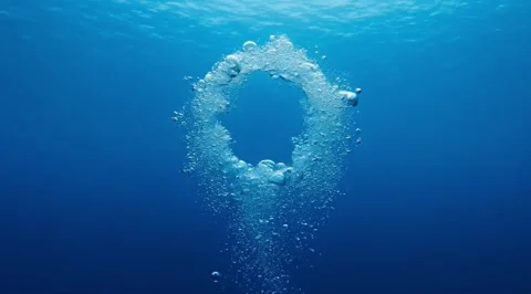 Bubble ring rising through deep blue water Stock Footage 331458289