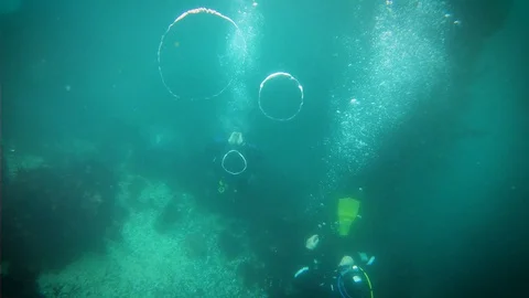 Bubble Rings From Scuba Divers Stock Footage 129102667