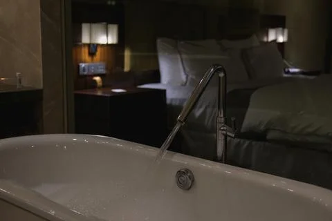 Bubble soap inside a bathtub of a luxury hotel business suite Fotos de archivo