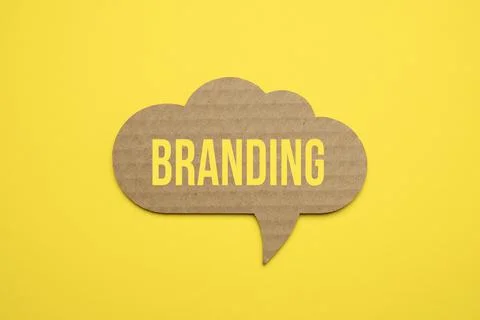 Bubble speech with cut out phrase Branding in the paper. Stock Photos