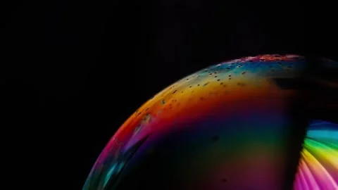 Bubble surface in motion isolated on black background, macro shot Stock Footage 154627290