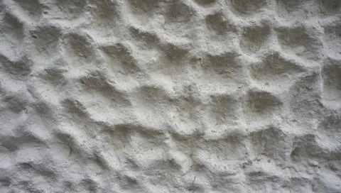 Bubble texture on white cement wall finishing horizontal Stock Photos