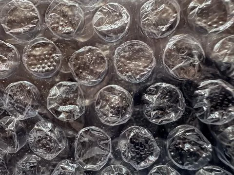 Bubble wrap close-up macro texture background with transparent plastic air .. 库存照片