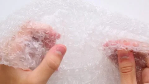 Bubble Wrap Clutching and Bursting ASMR Session Stock Footage 315614022
