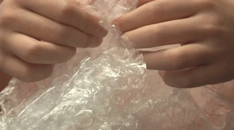 Bubble Wrap in the hands of a child Stock Footage 39153921