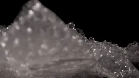 Bubble wrap isolated on a black background. Packaging plastic. Stock Footage 117526072