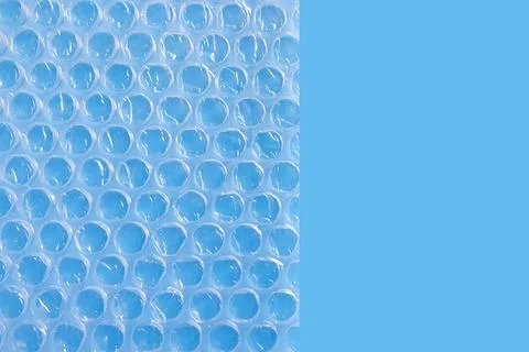 Bubble Wrap Packing Or Air Cushion Film on blue background. Stock Photos