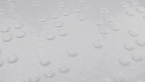 Bubble Wrap Popping 3D Animation White Plastic Packaging Background. 4K Видео 334776859