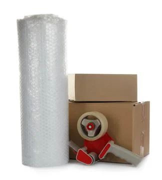 Bubble wrap roll, cardboard boxes and tape dispenser on white background Stock Photos