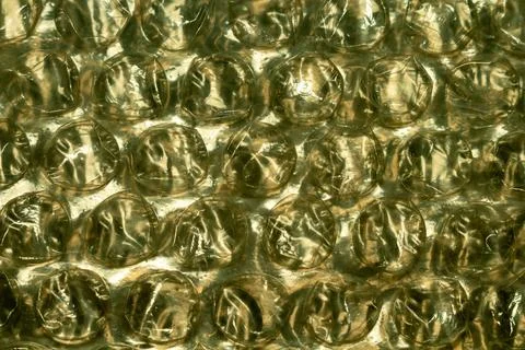 Bubble wrap texture detailed background golden tones protective packaging Stock Photos