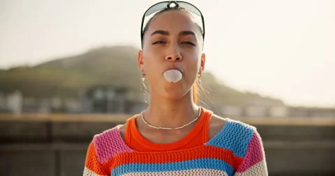 Bubblegum, gen z and student with face of woman in city for youth, culture and Stock Footage 305873863