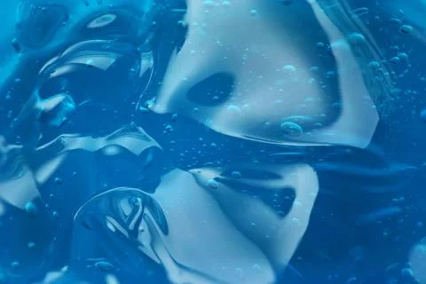 Bubbles in abstract blue gel Stock Photos