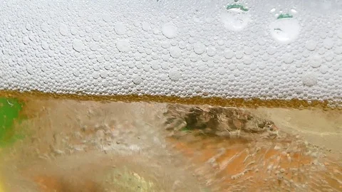 Bubbles of air carbon dioxide in beer float to the top. Slow motion 스톡 동영상 83109384