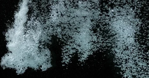 Bubbles of Air in the Water on Black Background, Slow Motion 4K Stock Footage 75970454
