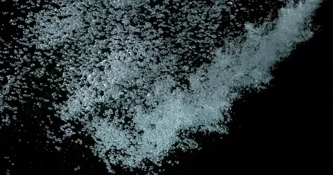 Bubbles of Air in the Water on Black Background, Slow Motion 4K Stock Footage 75970496