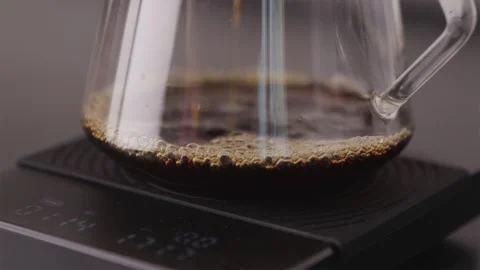 Bubbles and aeration in glass server filled with fresh coffee Stock Footage 332720227