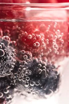 Bubbles and fruit under water Stock Photos