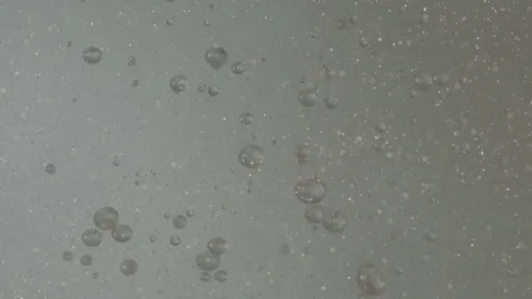 Bubbles and Gold Glitter Background Stock Footage 77778963