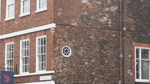 Bubbles and a house Stock Footage 91004729