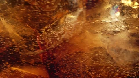 Bubbles and Ice Cubes in a Glass of Cola or Lemonade Vídeo Stock 246632496