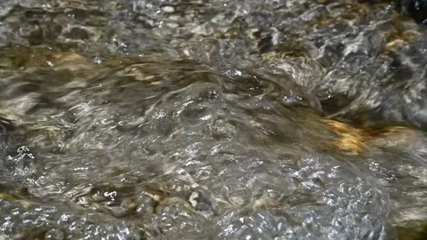 Bubbles and sunlight effects on flowing water (slow motion) Stock-Footage 212749451