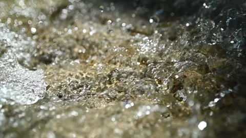 Bubbles and sunlight effects on a mountain river (slow motion) Stock Footage 212766893