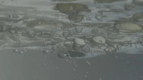 Bubbles and Waves from Underneath Surface Stock Footage 76168118