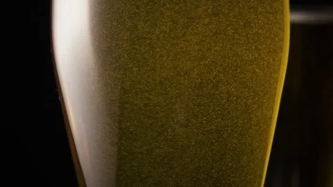 Bubbles are moving into a beer glass Stock Footage 72646626