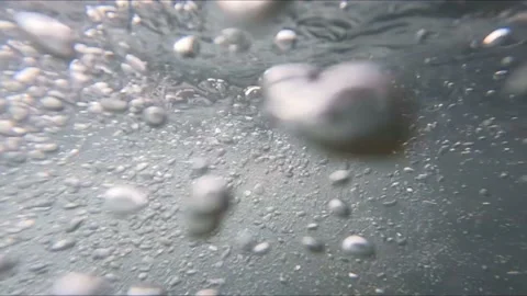 Bubbles ascending in clear glacier water in Norway, Buarbreen Stock Footage