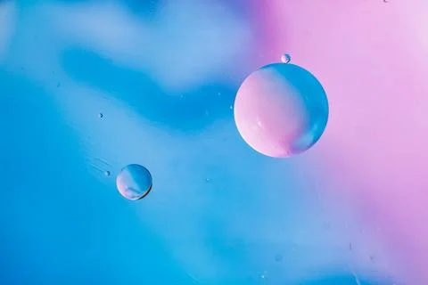 Bubbles backdrop in blue pink soft tones. Macro drops of oil on the surface of Stock Photos