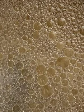 Bubbles. Background of small bubbles. Bubbles on the surface Stock Photos