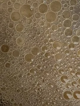 Bubbles. Background of small bubbles. Bubbles on the surface Stock Photos