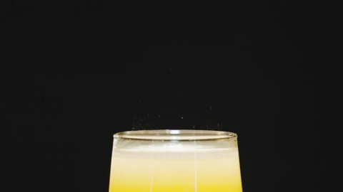 Bubbles beer in a glass on a black background, slow motion Stock Footage 171488345