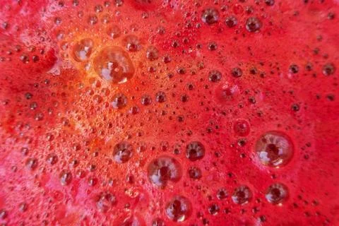 Bubbles on beetroot juice close-up, background, texture. Stock Photos