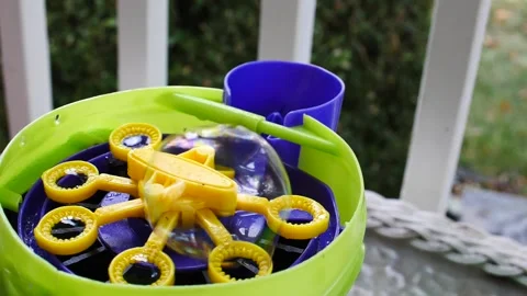 Bubbles being made with bubble machine close up in slow motion day 動画素材 207337726