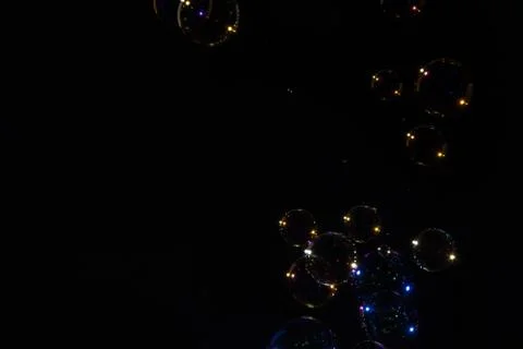 Bubbles black background Stock Photos
