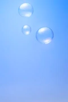 Bubbles on blue background Stock Photos