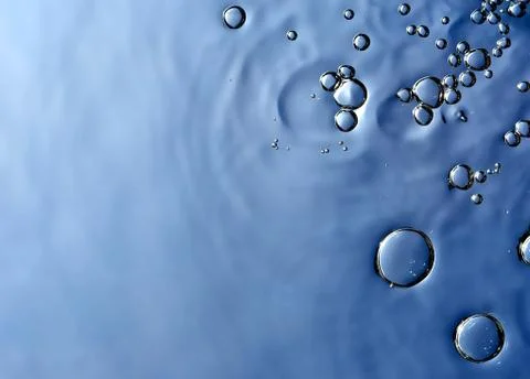 Bubbles on a blue background randomly grouped floating Stock Photos