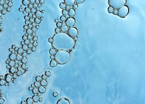 Bubbles on a blue background randomly grouped floating Stock Photos