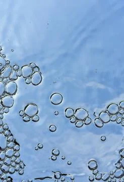 Bubbles on a blue background randomly grouped floating Stock Photos