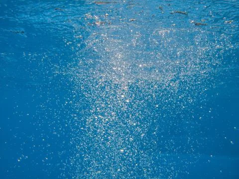 Bubbles in blue clear water Stock Photos