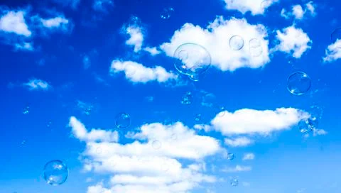 Bubbles on Blue Cloudy Sky Stock Photos