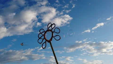 Bubbles with blue sky background with clouds Video stock 100940260
