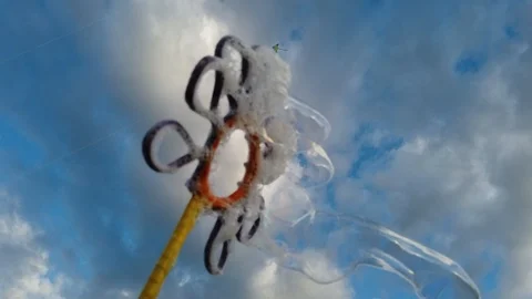 Bubbles with blue sky background with clouds Video stock 100941418